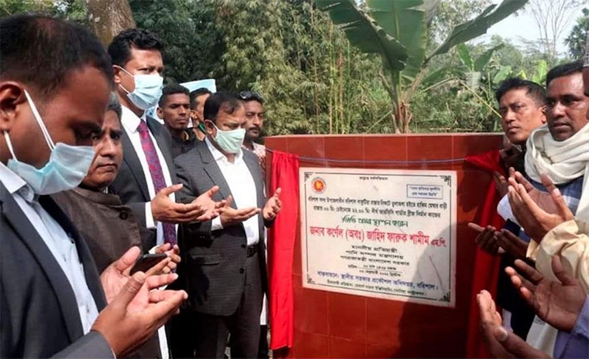 State Minister for Water Resources Zahid Faruque along with others offers munajat after laying foundation stone of various development projects at Balur Math of Kashipur union in Barishal on Friday.