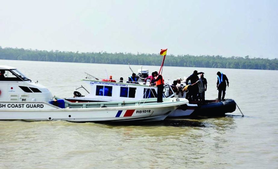 Coast Guard members of Eastern Zone deployed in Mongla conduct rescue operation for fishermen who went missing as 20 fishing trawlers sank on Friday night in Dublarchar of the Sundarbans and in different parts of the Bay of Bengal during storm. NN photo