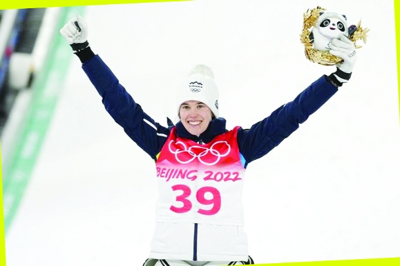 Ursa Bogataj of Slovenia, celebrates after winning gold in the women's normal hill individual ski jumping event at the 2022 Winter Olympics in Zhangjiakou, China on Saturday.