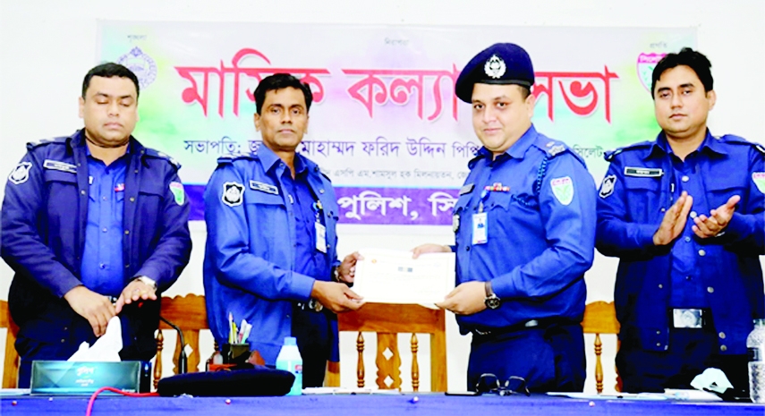 SYLHET: Md Lutfar Rahman, Additional Superintendent of Sylhet District Police receives IGP award from Mohammad Farid Uddin Ahmed PPM, Superintendent of Police, Sylhet District at the monthly Welfare and Crime meeting of Sylhet District Police on Thursday.