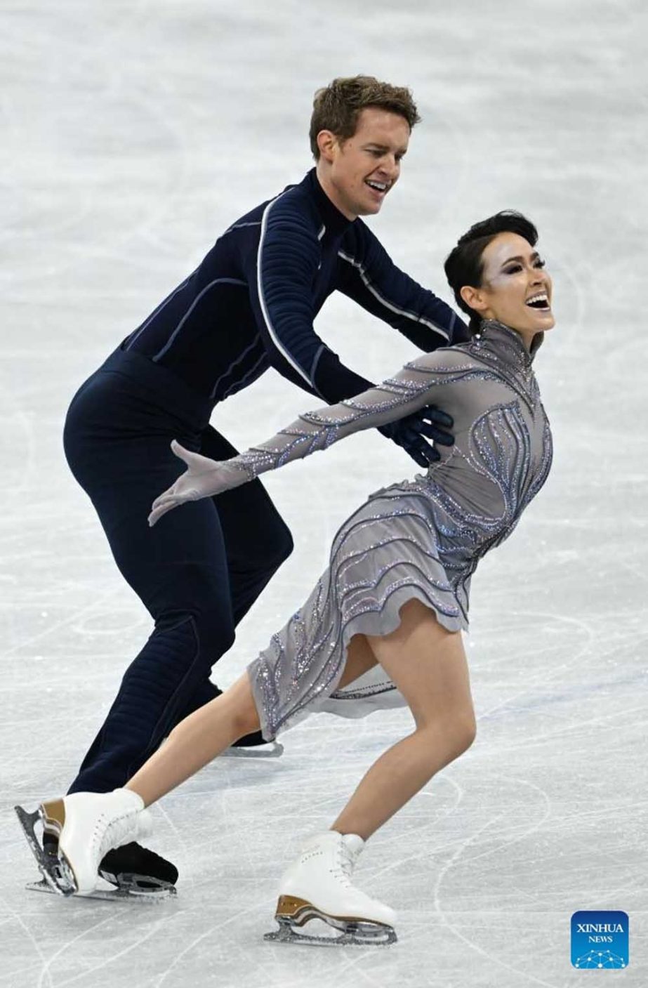 Madison Chock (left) and Evan Bates of the United States perform during the figure skating team event of ice dance at Capital Indoor Stadium in Beijing, capital of China on Monday. Agency photo
