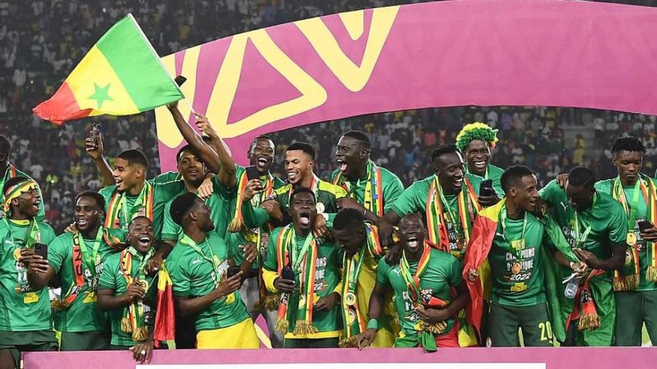 Senegal's players celebrate with trophy after winning the African Cup of Nations 2022 final soccer match against Egypt at the Olembe stadium in Yaounde, Cameroon on Sunday. AP photo