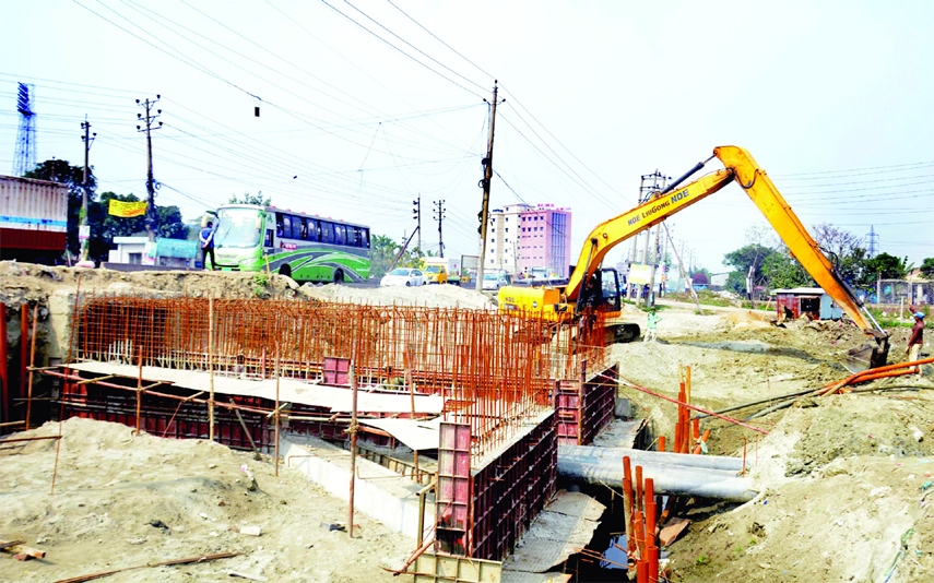 The construction work of |Dhaka-Narayanganj link road expansion along with culvert is going on rapidly. This picture was taken from in front of Fatulla Stadium on Monday.