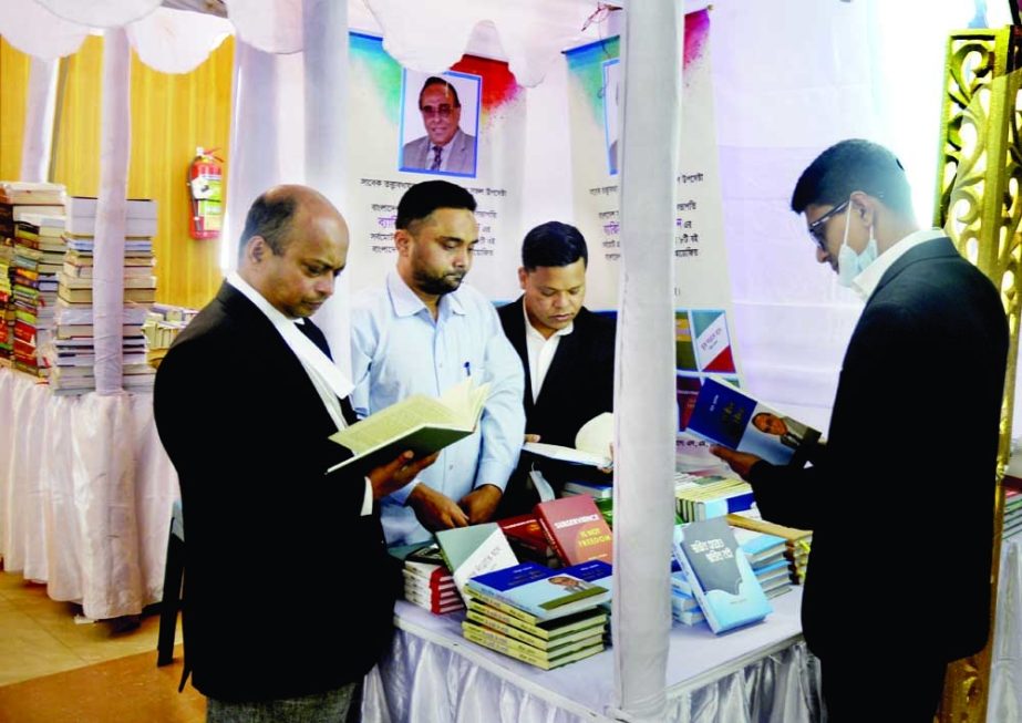 Lawyers visit a book stall at a fair of the Supreme Court Bar Association (SCBA) that began on Monday. NN photo