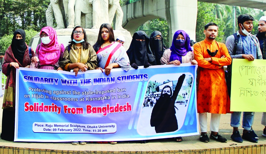 Students of Dhaka University stage a rally in front of Raju sculpture at TSC area on Wednesday demanding the assurance of wearing hijabs of women.