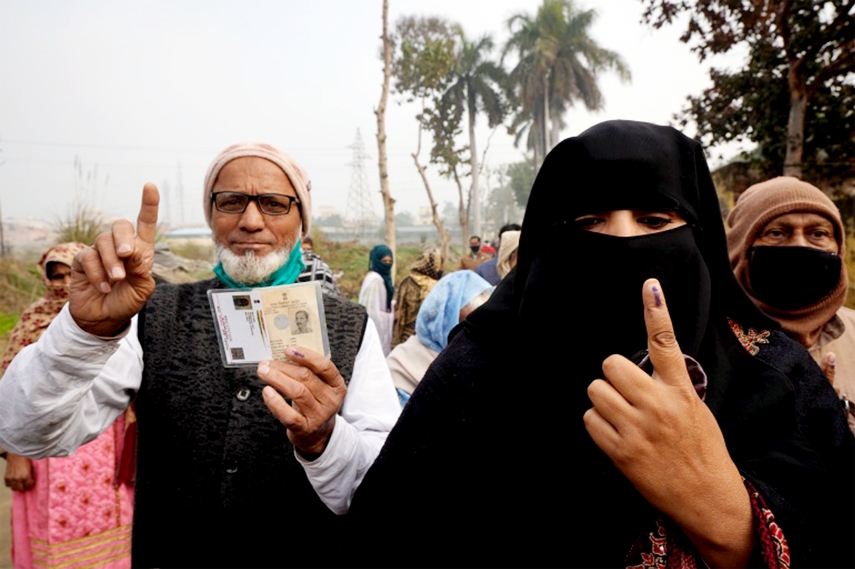 Voters in Uttar Pradesh state display their index fingers after casting their votes during the first phase of assembly elections in Muradnagar, India.