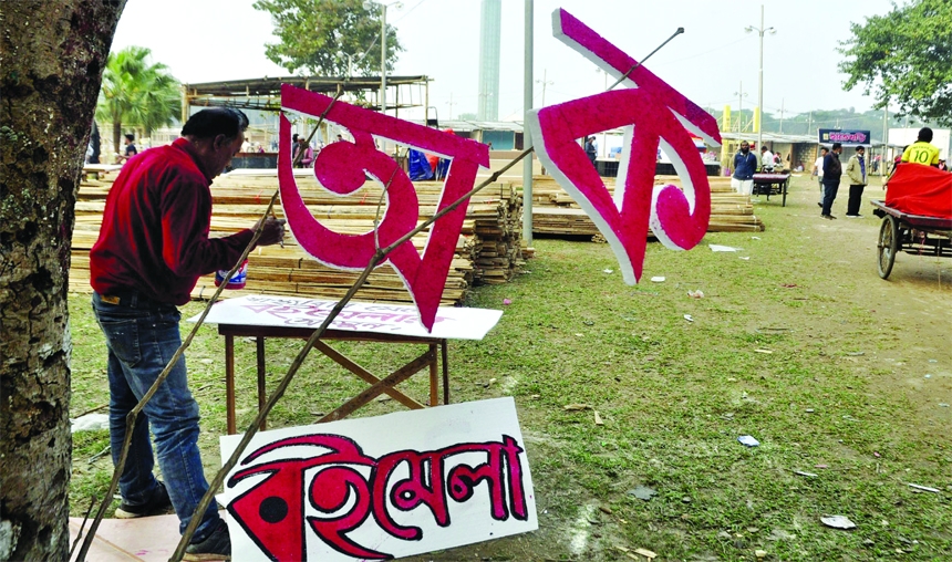Shopkeepers are seen busy with refurbishing stalls at Suhrawardy Udyan in the capital on Friday ahead of Bangla Academy Amor Ekushey Book Fair to be launched 15 February.