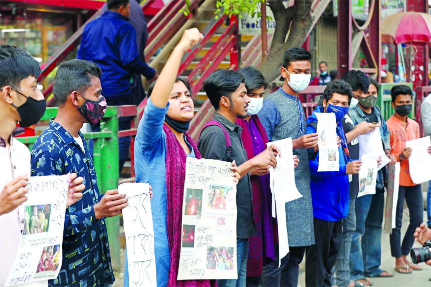 A girl chants slogan during a human chain in the capital's Rampura area on Friday demanding safer roads.