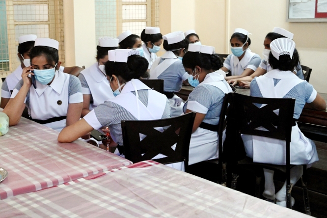 Sri Lankan health workers take part in strike yesterday as the government formulated tough regulations banning strikes in the health and electricity sectors..