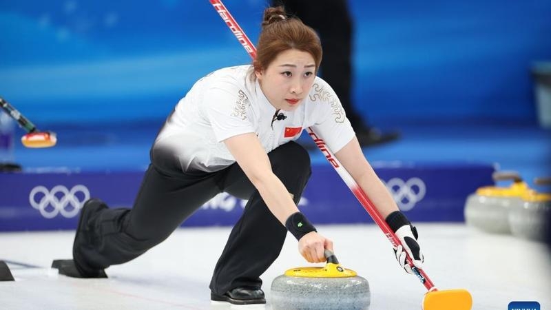 Zhang Lijun of China competes during the Curling Women's Round Robin Session 5 of the Beijing 2022 Winter Olympics between Sweden and China at the National Aquatics Center in Beijing, capital of China on Saturday. Agency photo