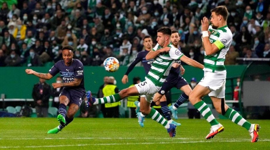 Manchester City's Raheem Sterling (left) scores his side's fifth goal during the Champions League round of 16 match between Sporting CP and Manchester City at the Alvalade stadium in Lisbon, Portugal on Tuesday. AP photo