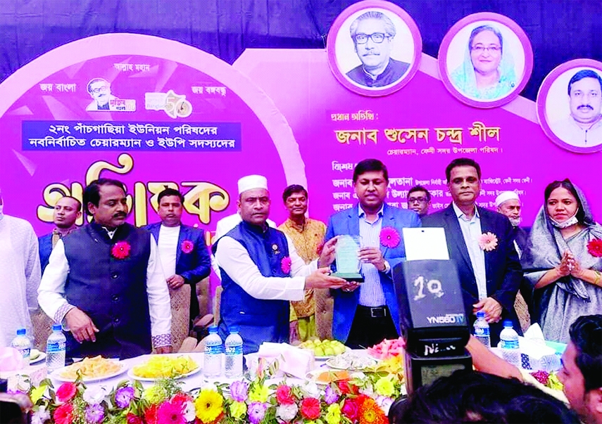 FENI: Shusen Chandra Sheel, Chairman, Feni Sadar Upazila Parishad greets newly elected chairman and members of Panchgachhiya Union Parishad during a citizen's meeting as Chief Guest on Thursday.