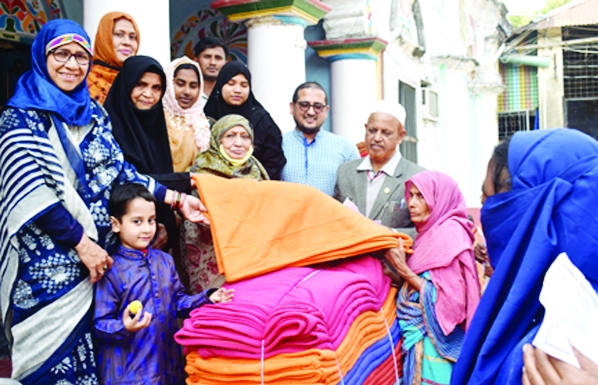 BOGURA: Blankets distribute among the poor people at Azad Manjil in Kolakopa Union in Gabtoli Upazila on the occasion of the 29th death anniversary of Haji Bibi Hayatun Nesa Talukder on Friday.