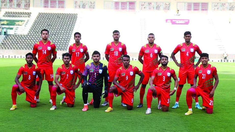 Players of Bangladesh Football team pose for a photo session before taking part in a match recently. File photo