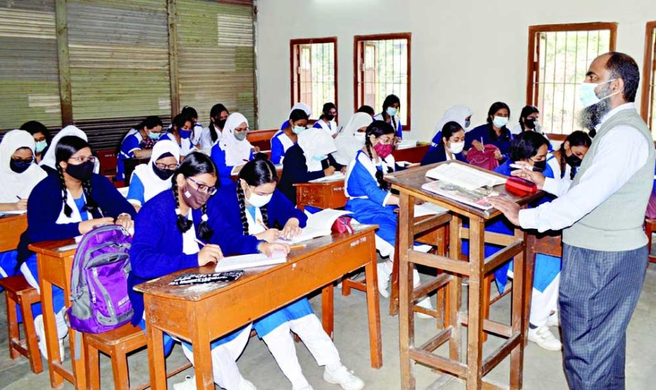 Students attend a class at a school in the capital as senior schools and universities reopened for classes on Tuesday after a month-long closure due to Civid-19 pandemic. NN photo
