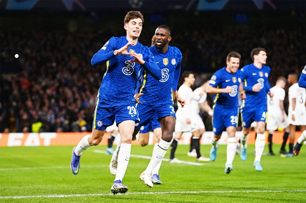 Chelsea's German midfielder Kai Havertz (left) celebrates with teammates after scoring a goal during the UEFA Champions League round of 16 first leg football match between Chelsea and Lille at Stamford Bridge stadium, in London on Tuesday.