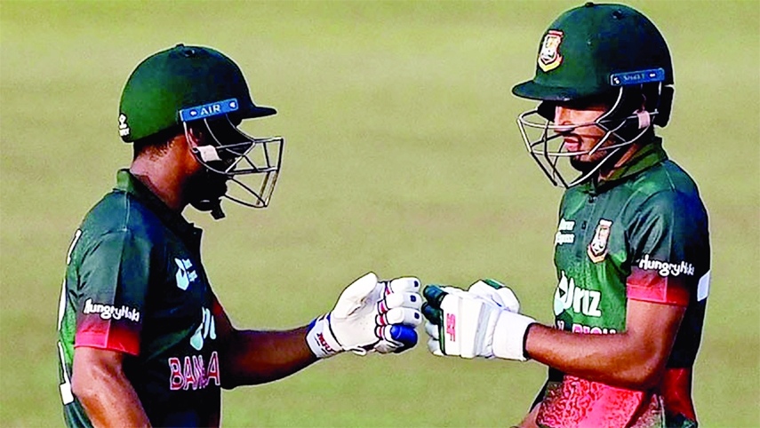 Afif Hossain (right) and Mehidy Hasan Miraz of Bangladesh toast during the first One Day International match against Afghanistan at Zahur Ahmed Chowdhury Stadium in Chattogram on Wednesday.