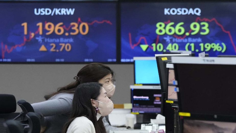 Currency traders watch monitors at the foreign exchange dealing room of the KEB Hana Bank headquarters in Seoul, South Korea, Thursday, Feb. 24, 2022.