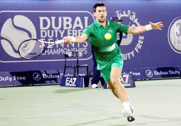 Serbia's Novak Djokovic returns against Russia's Karen Khachanov during their ATP Dubai Duty Free Tennis Championship round of 32 on Wednesday.