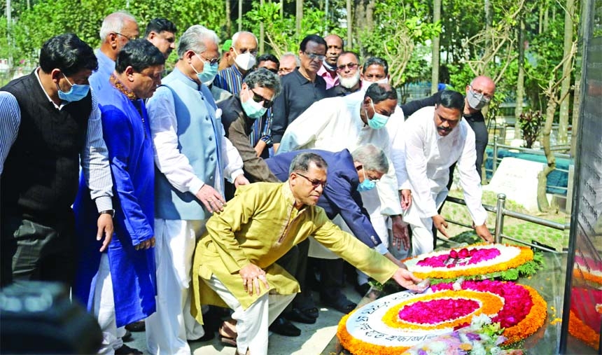 BNP Secretary General Mirza Fakhrul Islam Alamgir along with party colleagues pay floral tributes on the graves of Pilkhana martyrs in the city's Banani Army Graveyard on Friday marking the 13th anniversary of Pilkhana BDR Tragedy.