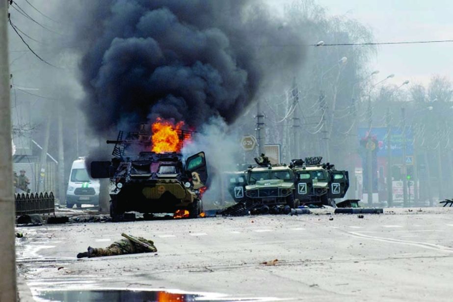 A Russian armored personnel carrier burns amid damaged and abandoned light utility vehicles after fighting in Kharkiv, Ukraine. Agency photo