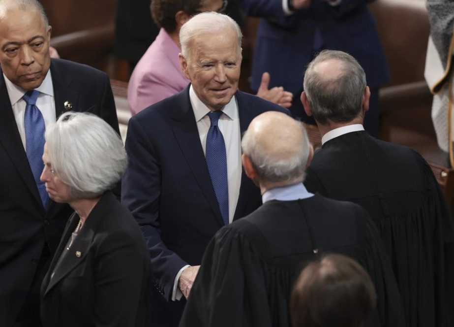 President Joe Biden arrives and greets lawmakers before delivering his State of the Union address to a joint session of Congress at the Capitol, Tuesday, March 1, 2022, in Washington.