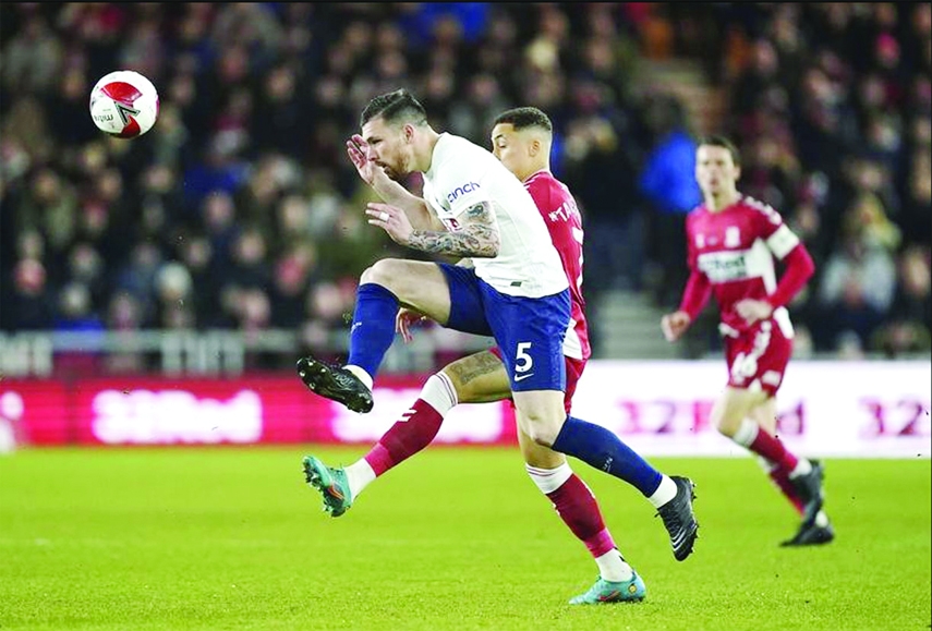 Tottenham's Pierre-Emile Hojbjerg (front) heads the ball clear during the English FA Cup fifth round soccer match against Middlesbrough at the Riverside Stadium, Middlesbrough, England on Tuesday.