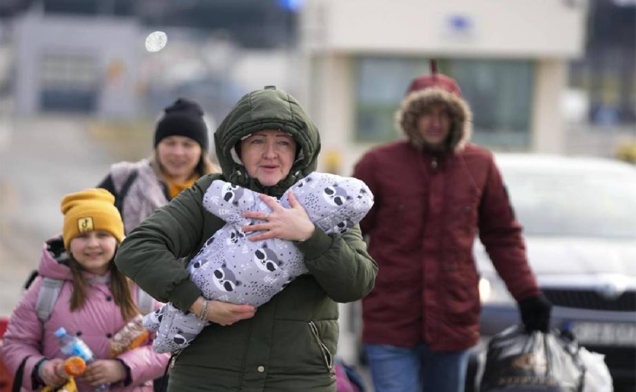 A family arrive at the border crossing in Medyka, Poland, Wednesday, March 2, 2022.