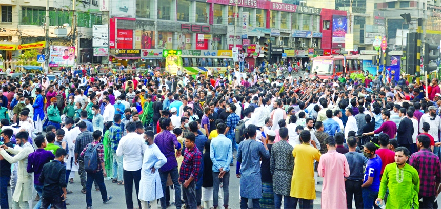 Gono Odhikar Parishad activists bring out a procession on a city street on Friday protesting against price hike of daily essential commodities.