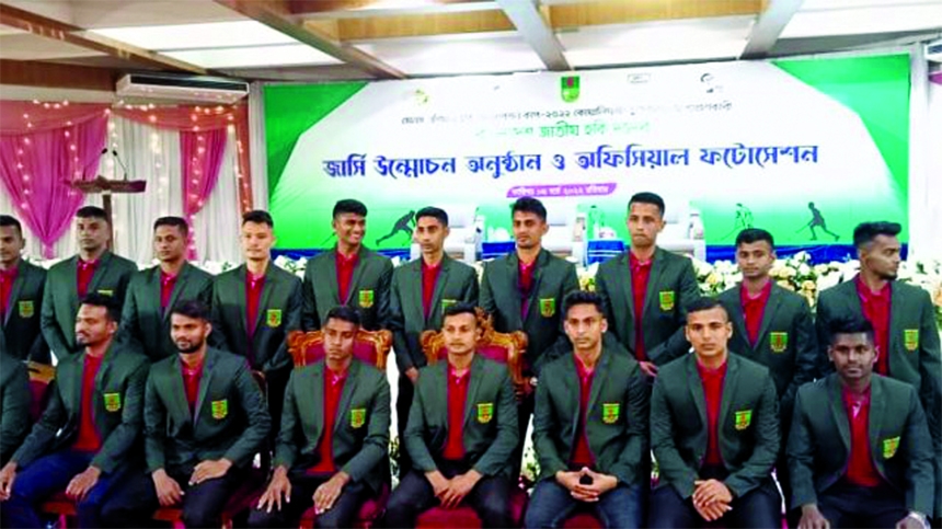 Members of Bangladesh Hockey team pose for a photo session at the Falcon Hall of Bangladesh Air Force in Dhaka Cantonment on Sunday.