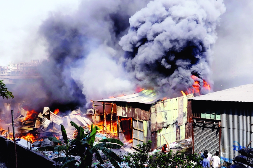 Black smoke billows from flames as a fire broke out at a scrap shop in Bhatara area of the capital on Sunday.