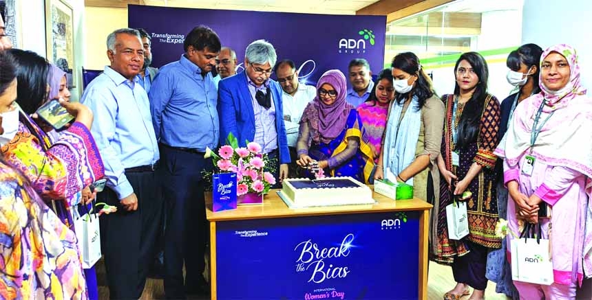 Asif Mahmood, Chairman of ADN Group, cutting a cake marking The International Women's Day 2022 at its head office in the capital on Tuesday. Zahir Ahmed, Shahriar Akbar Chowdhury, Vice Chairmen and other senior officials of the company, were present.