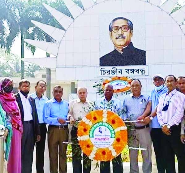 ISHWARDI (Pabna) : Dr. Amjad Hossain, Director General of the Bangladesh Sugarcrop Research Institute places wreath with other officials at the mural of Father of the Nation Bangabandhu marking the March 7 on Monday.