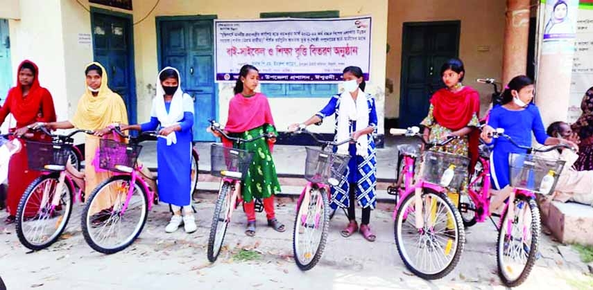 ISHWARDI (Pabna): Students of small ethnic group of secondary level get bicycles on Ishwardi Upazila Parishad Office premises on Wednesday.