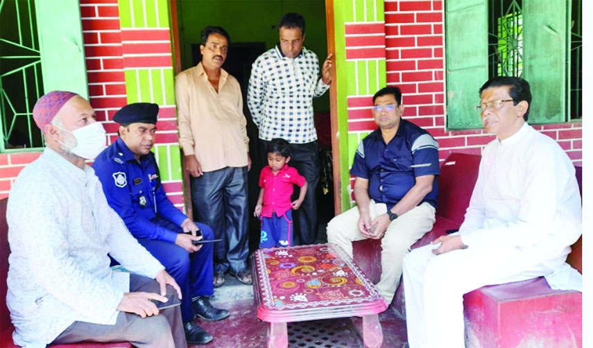 BETAGI (Barguna): Jahngir Mollik, SP, Barguna with other distinguish persons console Maksudur Rahman, Chairman, Betagi Upazila, uncle of late Hadisul at Kadamtola Village on Thursday.
