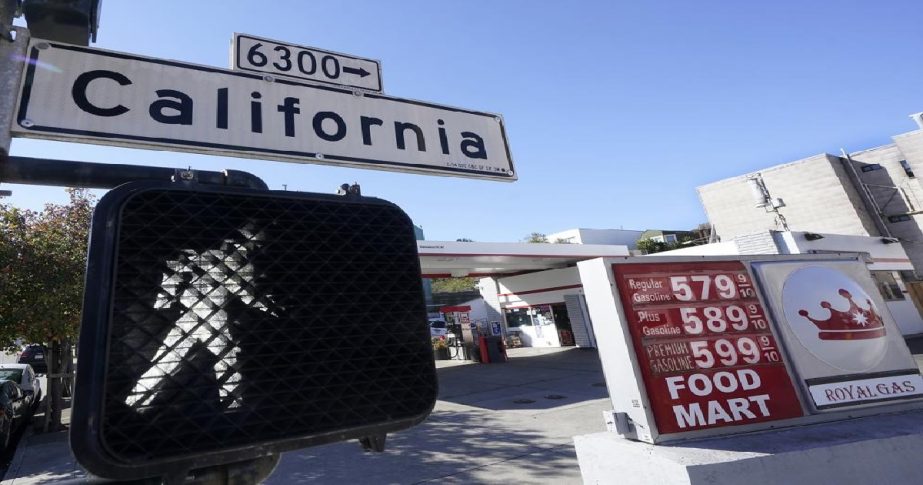 A California street sign is shown next to the price board at a gas station in San Francisco, on March 7, 2022. File photo