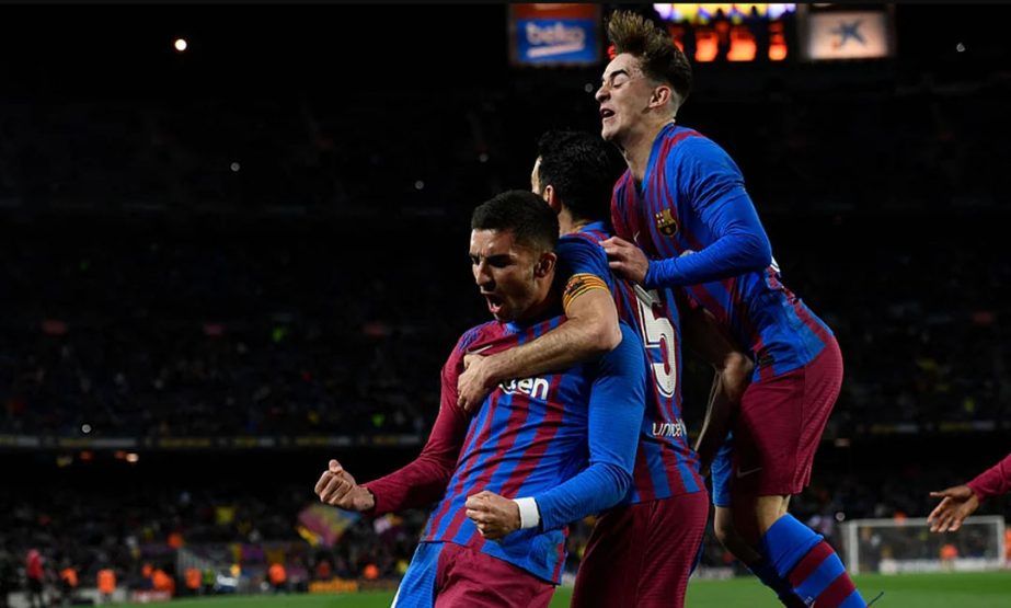 FC Barcelona's forward Ferran Torres (left) celebrates with teammates after scoring a goal during the Spanish league football match against CA Osasuna at the Camp Nou stadium in Barcelona on Sunday. Agency photo
