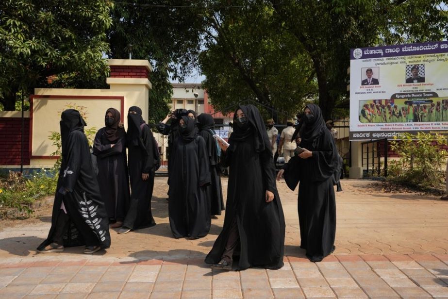 Indian Muslim students wearing burqas leave Mahatma Gandhi Memorial college after they were denied entry into the campus in Udupi, Karnataka state, India, Feb. 24, 2022.