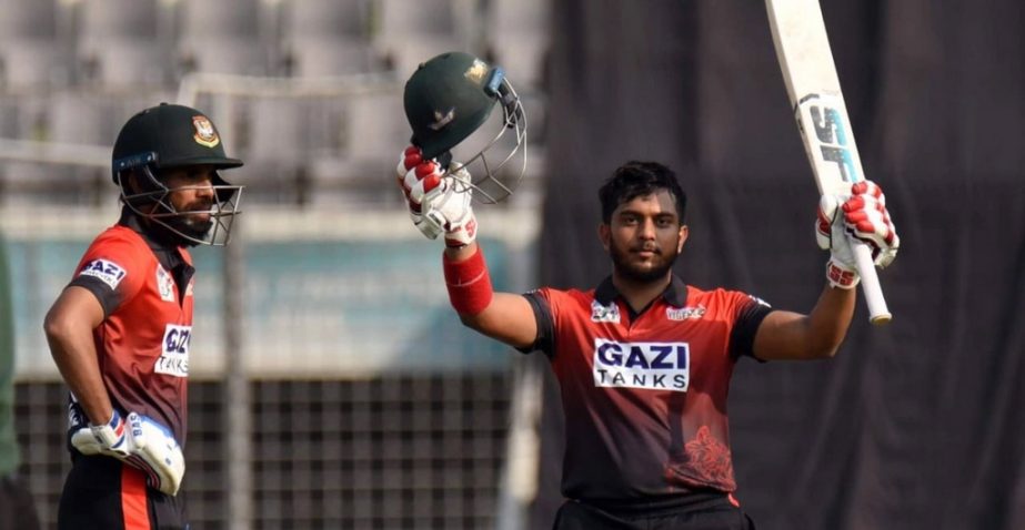 Zakir Hasan (right) of Rupganj Tigers, celebrates his century against Dhaka Abahani Limited in their first match of the Dhaka Premier Division Cricket League at the Sher-e-Bangla National Cricket Stadium in the city's Mirpur on Tuesday. Agency photo