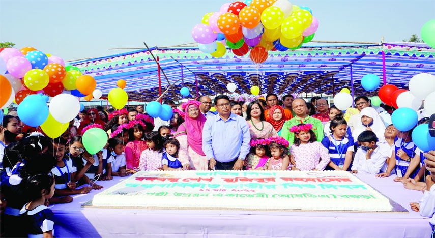 BOGURA: Khalil Ahmed, Director General of Bogura Palli Unnoyon Academy cuts a cake to observe the birth anniversary of Father of the Nation Bangabandhu Sheikh Mujibur Rahman and National Children's Day on Thursday.