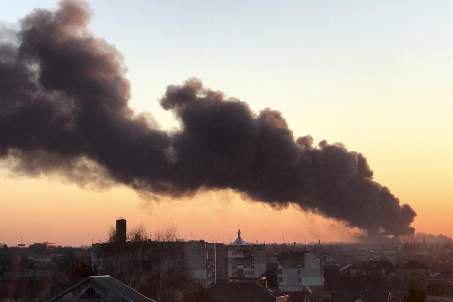 A cloud of smoke raises after an explosion in Lviv, western Ukraine, Friday, March 18, 2022. The mayor of Lviv says missiles struck near the city's airport early Friday.