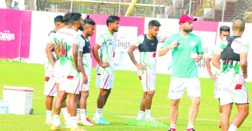 Members of Bangladesh Football team take part in their practice session at Bashundhara Sports Complex in the city on Monday.