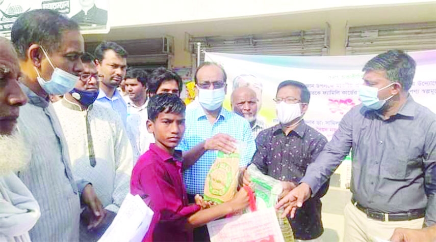 SHIBGANJ (Chapainawabganj): Dr Shamil Uddin Ahmed Shimul MP inaugurates the TCB activities of distribution essentials among the needy people at cheap rate at Nutun Bazar area of Shibganj Upazila on Sunday.