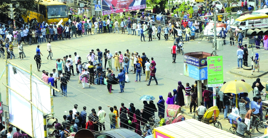 Seven Dhaka-University affiliated college students baffle Nilkhet intersection on Tuesday demanding auto promotion to the next year without holding any exams due to Covid-19.