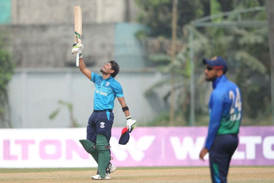 Anamul Haque (left) of Prime Bank Cricket Club celebrates his century against Shinepukur Cricket Club in the match of the Bangabandhu Dhaka Premier Division Cricket League at BKSP Ground-4 in Savar on Sunday. Agency photo