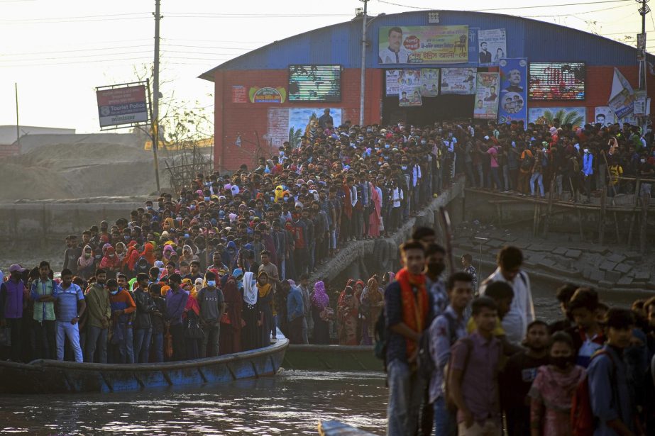 Workers gather in the morning at a boat terminal waiting to cross the Mongla river in Mongla, Bangladesh. AP photo