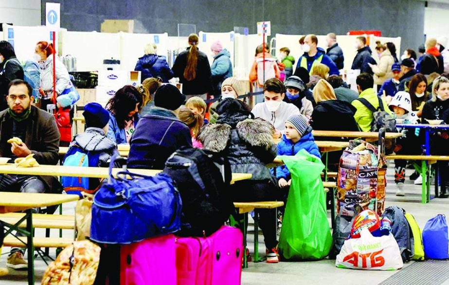 People fleeing from Ukraine eat and get some rest at a welcome centre upon their arrival at Berlin's Hauptbahnhof central station in Berlin on Tuesday. Agency Photo