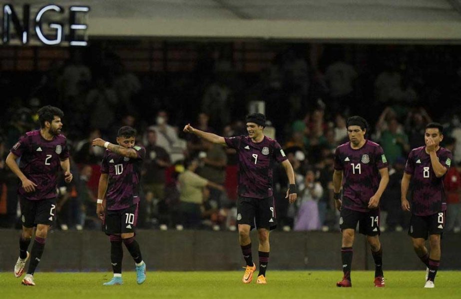 Mexico's Raul Jimenez (center) celebrates after scoring his side's second goal against El Salvador during a qualifying soccer match for the FIFA World Cup Qatar 2022 in Mexico City on Wednesday. AP photo