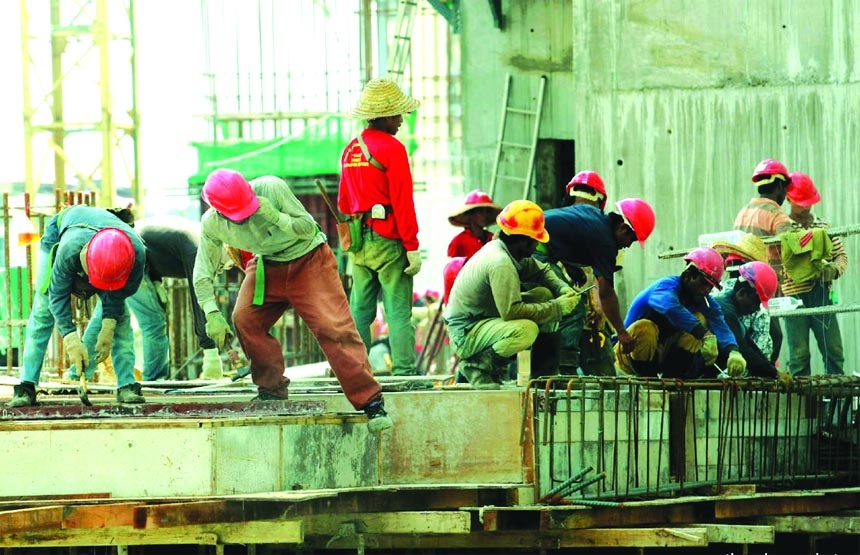 Bangladeshi workers engage in a construction project in Malaysia