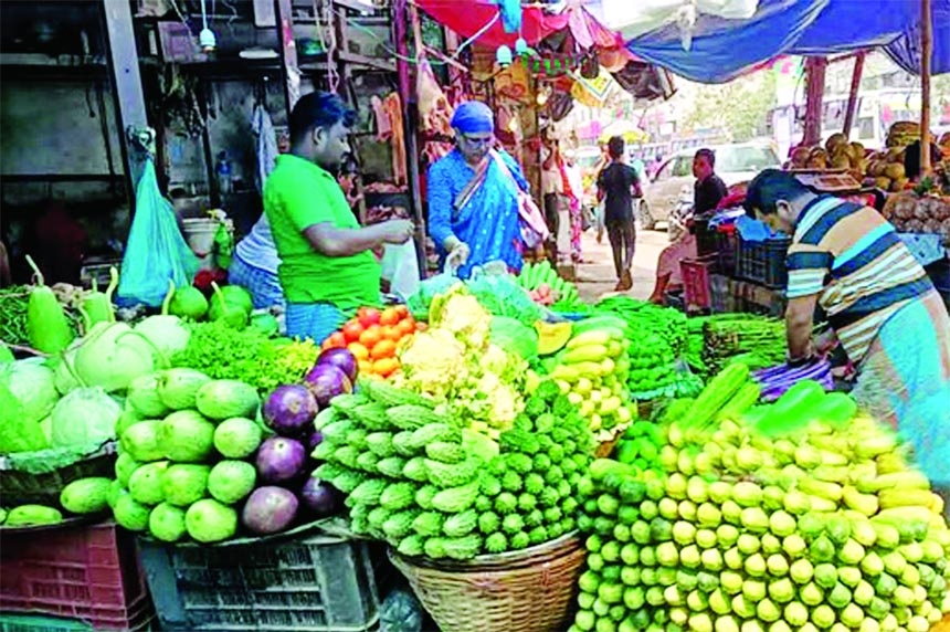 A vendor sells vegetables at a shop in the capital on Friday amid soaring prices of essentials commodities.
